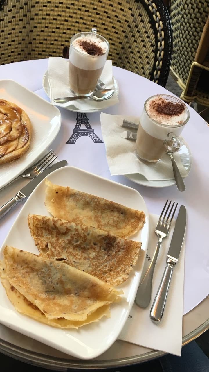 Original photo: crêpes, an apple tart and two cappuccinos on a bistro table